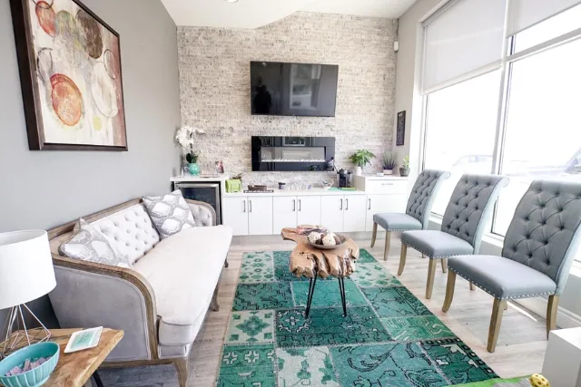 Waiting area with sofa and fireplace